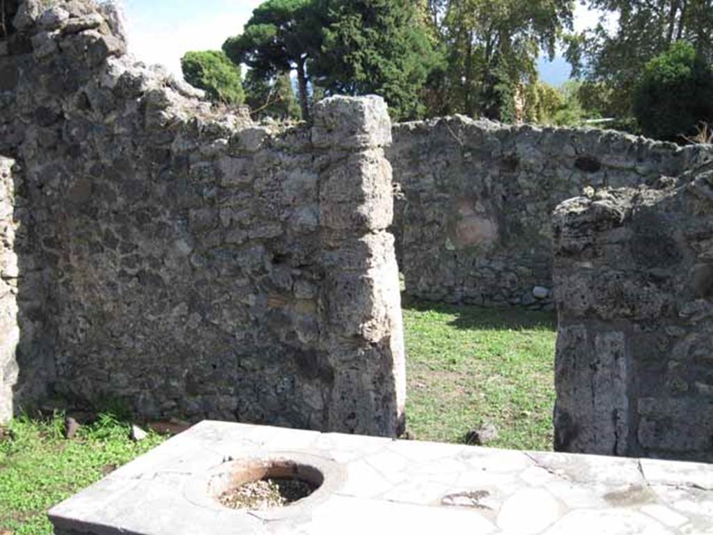 1.2.8 Pompeii. September 2010. South wall of bar-room with doorway into I.2.7. Photo courtesy of Drew Baker.
