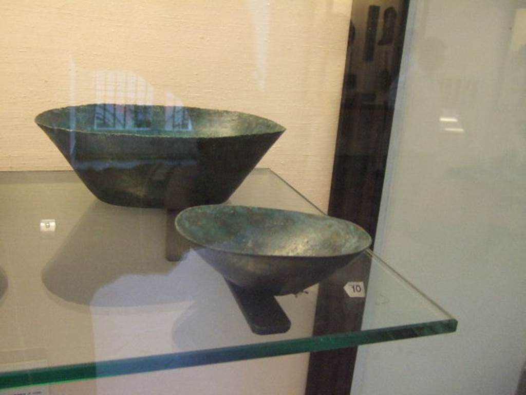 I.2.10 Pompeii. Found in atrium. Bronze bowls. Now in Naples Archaeological Museum. Inventory numbers: 110065 and 110067.
