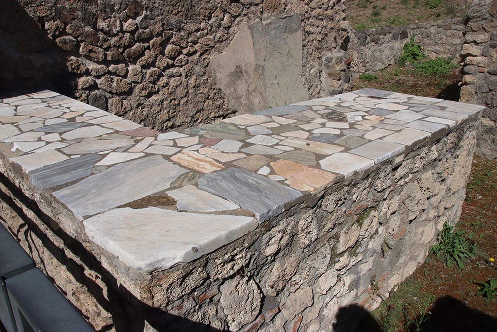 I.2.11 Pompeii. October 2024. Looking north-east across counter. Photo courtesy of Klaus Heese.