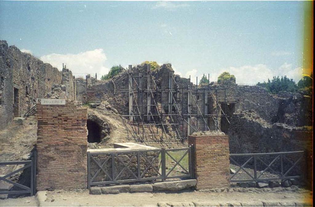 I.2.13 Pompeii. July 2011. Looking towards entrance doorway from Via Stabiana. Photo courtesy of Rick Bauer.
Warscher described this, quoting Fiorelli, as 
“I.2.12/13 – due taberne aventi comunicazione tra loro.  Il podio è rivestito di marmi.  
Qui l’insula è delimitata dalla via secunda, sulla quale si aprono gl’ingressi di altre abitazioni”.
See Warscher T., 1935. Codex Topographicus Pompeianus: Regio I.2. Rome: DAIR.
(translation: "I. 2.12/13 - two workshops having communication between them.  The podium was covered with marble.   Here the insula is bounded by via secunda, on which opens the entrances of other dwellings.")
