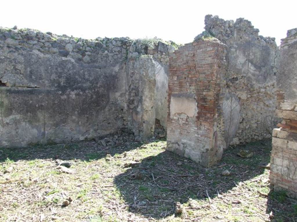 I.2.15 Pompeii. March 2009. Doorways to two rooms on west side of atrium.
According to Warscher, quoting Mau in Bull.Inst, 1873, p.240, she wrote –
“Adesso le pareti della casa in questione sono nude. Nell’anno 1873 Mau ha scritto –
“Un piccolo quadro molto distrutto si trova in una stanza a destra dell’atrio d’una casa sul lato del nord della stessa isola, la cui porta è la quarta contando dall’est.
Si distinguono due persone, delle quali quella seduta a sinistra è vestita di chitone giallo e clamide rossa. Mi pare essere un uomo. Gli sta dirimpetto un giovane che per il cappello e un bastone, che potrebbe essere un caduceo, forse deve ritenersi per Mercurio. Egli è vestito d’un chitone giallo, corto e cinto e d’una clamide che riposandogli sul braccio sinistra avvolge la parte media del corpo, lasciando libere le gambe. Stende la mano destra verso la persona assisa”.
See Sogliano, A., 1879. Le pitture murali campane scoverte negli anni 1867-79. Napoli: Giannini. (p.37, no.152, described as “Hermes e figura indeterminata”).
See Warscher T., 1935. Codex Topographicus Pompeianus: Regio I.2. Rome: DAIR.
(translation: "Now the walls of the house in question are nude. In the year 1873 Mau wrote – "A small very destroyed painting was located in a room to the right of the entrance hall of a house on the north side of the same insula, whose doorway was the fourth counting from the east. One can distinguish two people, the one sitting to the left was dressed in a yellow tunic and red cloak. It seemed to me to be a man. He was facing a young man that by his hat and a cane, that may have been a caduceus, perhaps should be considered to be Mercury. He was dressed in a short yellow tunic and girdle, and a cloak resting on his left arm that wrapped around the middle part of his body, leaving free the legs. He was extending his right hand towards the seated person.")