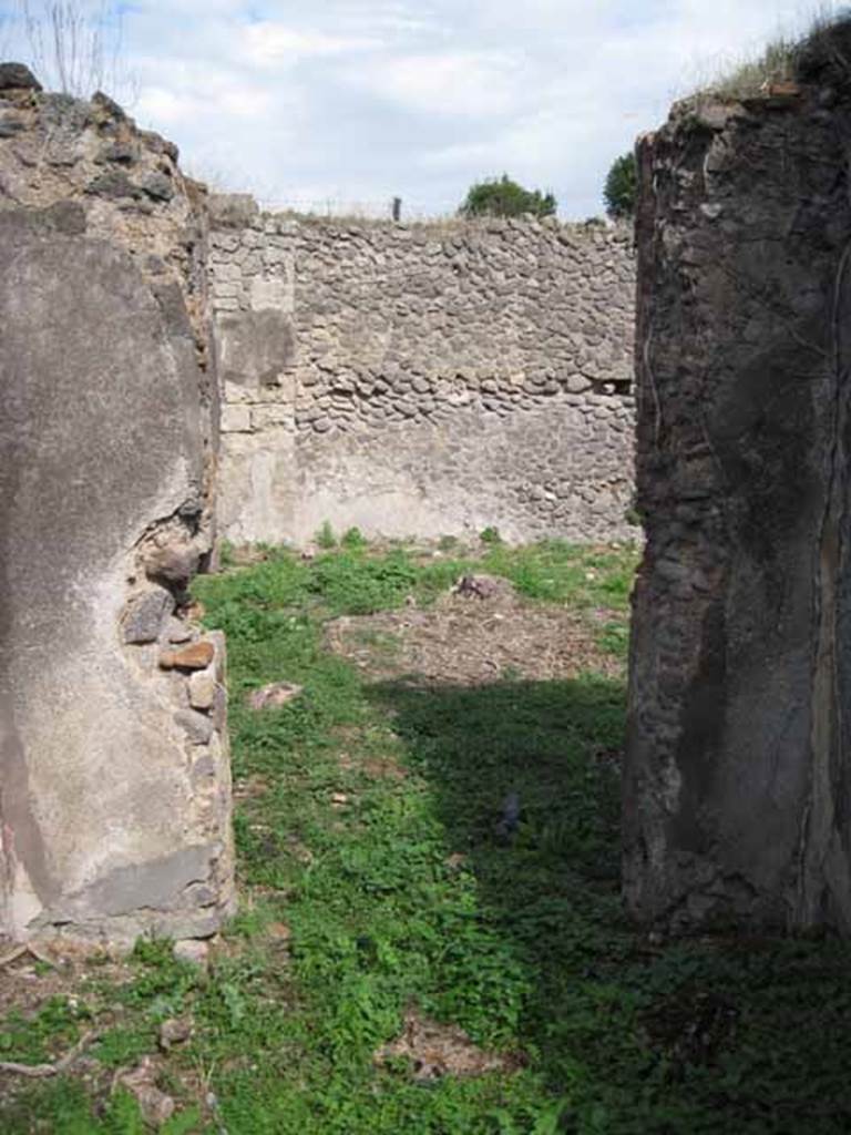 I.2.15 Pompeii. September 2010. East wall with doorway to atrium, of room on south side of corridor. Photo courtesy of Drew Baker.