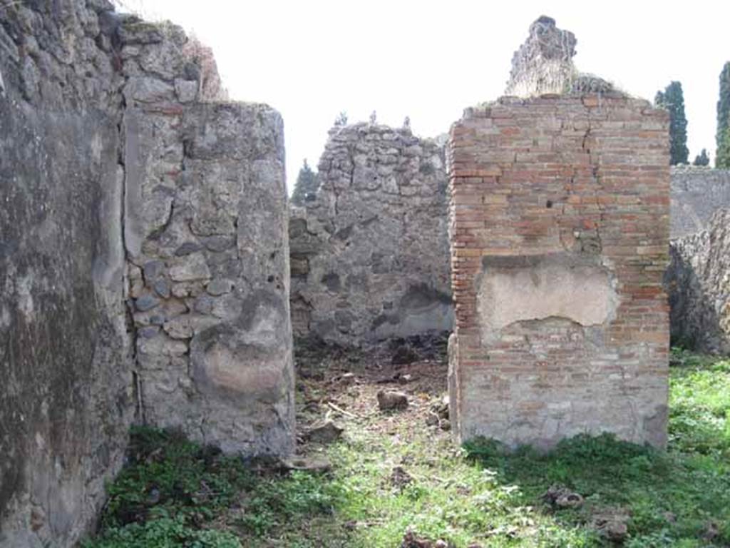 I.2.15 Pompeii. September 2010. Looking west to doorway to room in south-west corner of atrium. Photo courtesy of Drew Baker.