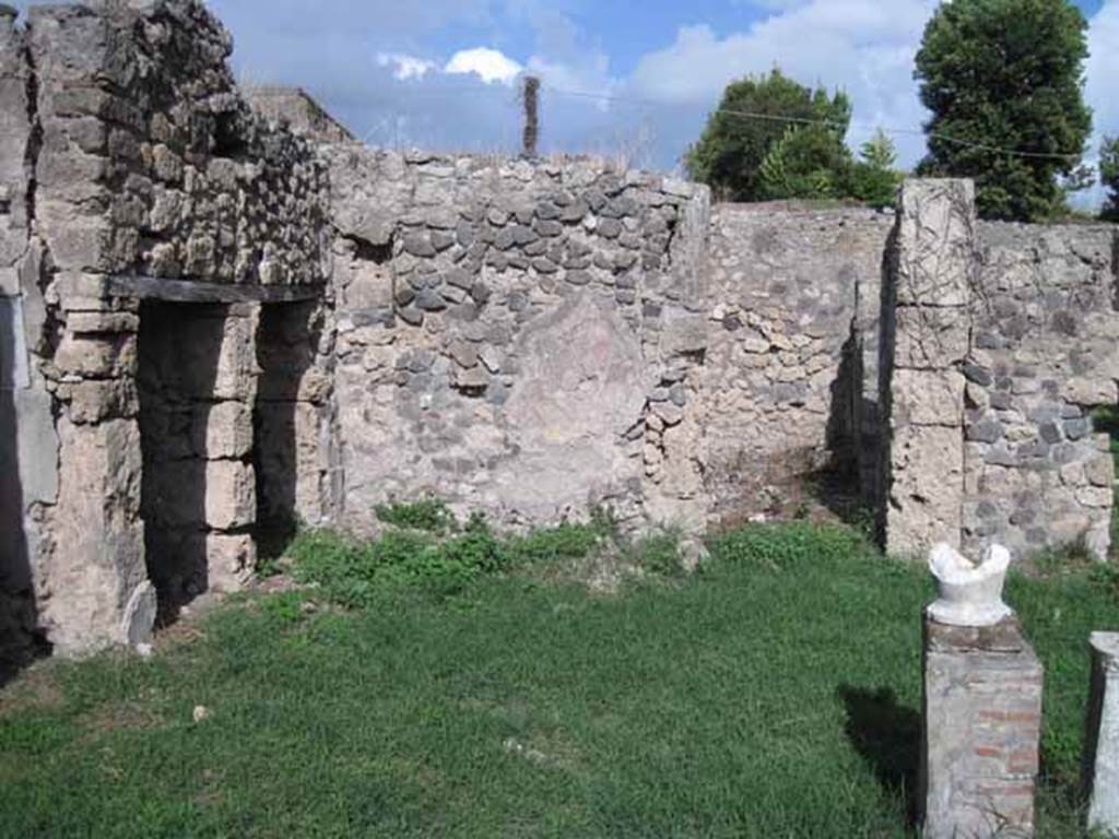 I.2.17 Pompeii. September 2010. Looking east across atrium. On the left are the doorways to rooms 2 and 3, centre right is the doorway to room 4.
Photo courtesy of Drew Baker.
