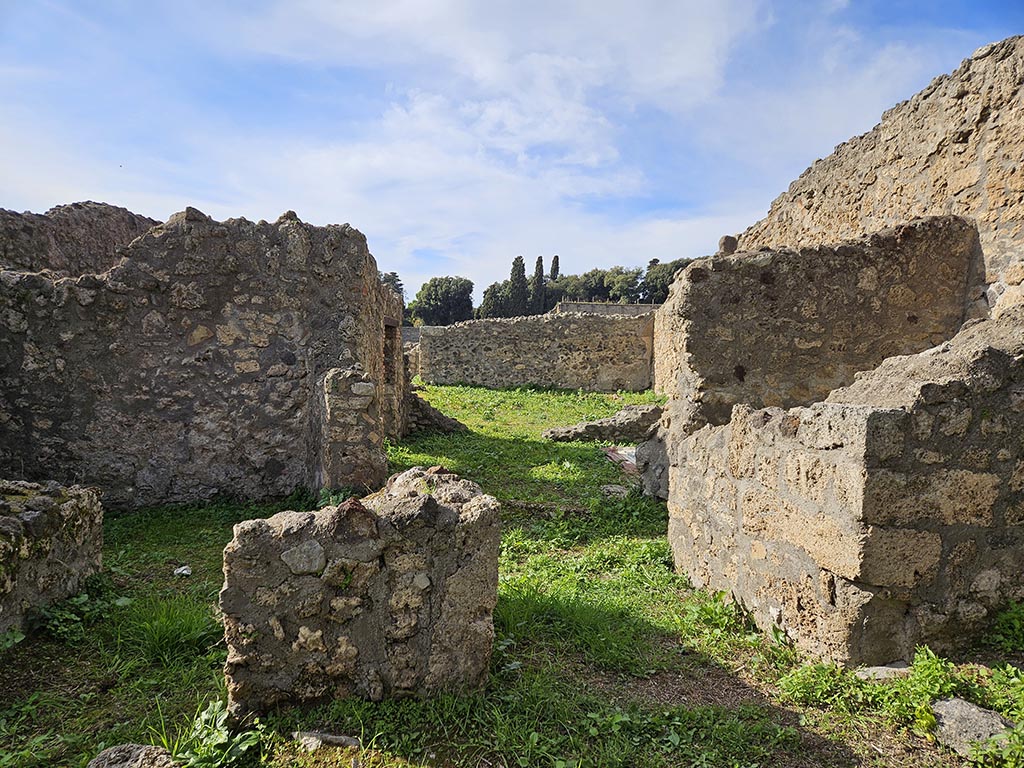 I.2.20 Pompeii. November 2024. 
Looking west towards entrance doorway, on right. On the left is the entrance into I.2.21. Photo courtesy of Annette Haug.
