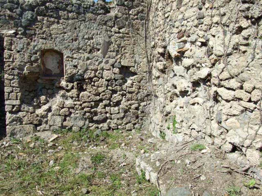 I.2.22 Pompeii.  March 2009.  Room 1.  North east corner of Shop, with remains of stairs to upper floor, and niche.