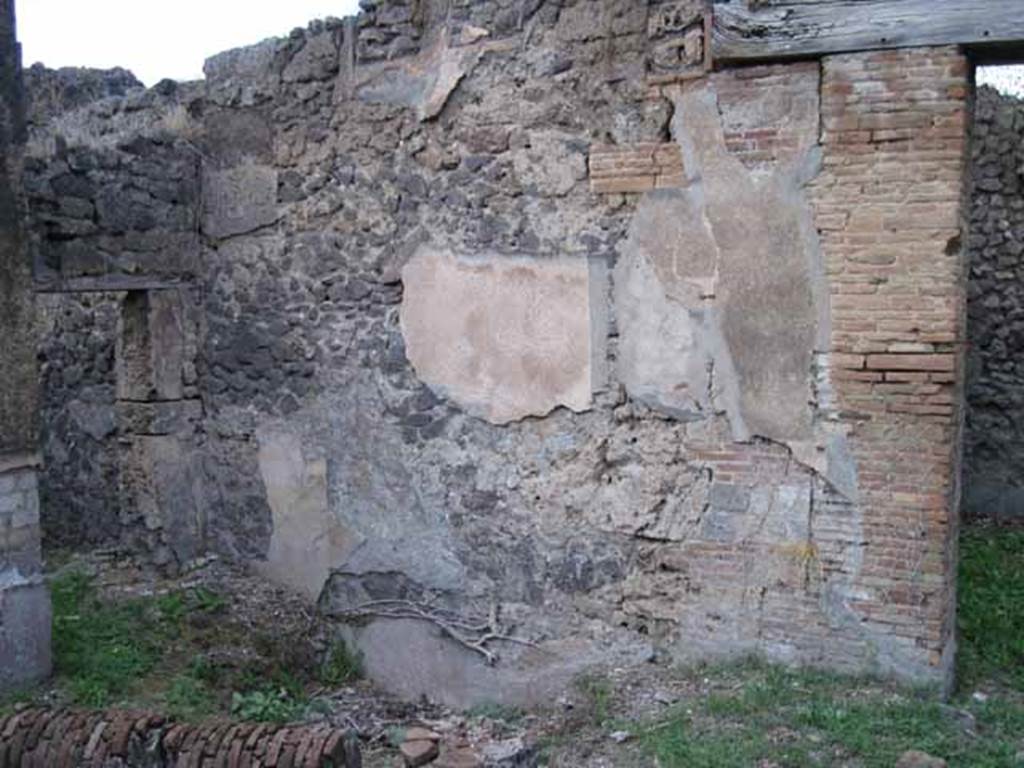 I.2.24 Pompeii. September 2010. North wall of atrium in north-west corner. Photo courtesy of Drew Baker.  According to Fiorelli, painted on the facing wall of the atrium was -
C . NONIVS . LORICA
P . INSTVLEIVS NEDYMVS         LIBRARI . QVI . C……
L . AELIVS . CYDINVS                  SVNT . HIC .SIN ……
ACILIVS . CEDRVS                       APPVLEI . ADIVTOR . ET…..      [CIL IV 3376]
See Pappalardo, U., 2001. La Descrizione di Pompei per Giuseppe Fiorelli (1875). Napoli: Massa Editore. (p.37)
According to Epigraphik-Datenbank Clauss/Slaby (See www.manfredclauss.de), it read –
C(aius) Nonius Lorica 
P(ublius) Instuleius Nedymus 
L(ucius) Aelius Cydinus 
Acilius Cedrus 
/ Librari qui C[3] 
sunt hic sine [3] 
Appulei adiutor et II[        (CIL IV 3376)


