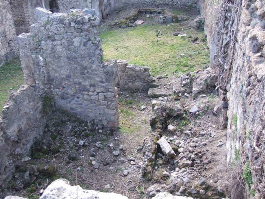 I.2.28 Pompeii.  March 2009.  Looking west above Kitchen area.  Taken from I.2.20.   According to Fiorelli, this comprised �an ample hearth, two rooms as cells, the latrine, a staircase to the floor above, and at the back of the portico a cupboard between two small masonry walls�.  See Pappalardo, U., 2001. La Descrizione di Pompei per Giuseppe Fiorelli (1875). Napoli: Massa Editore. p.38
