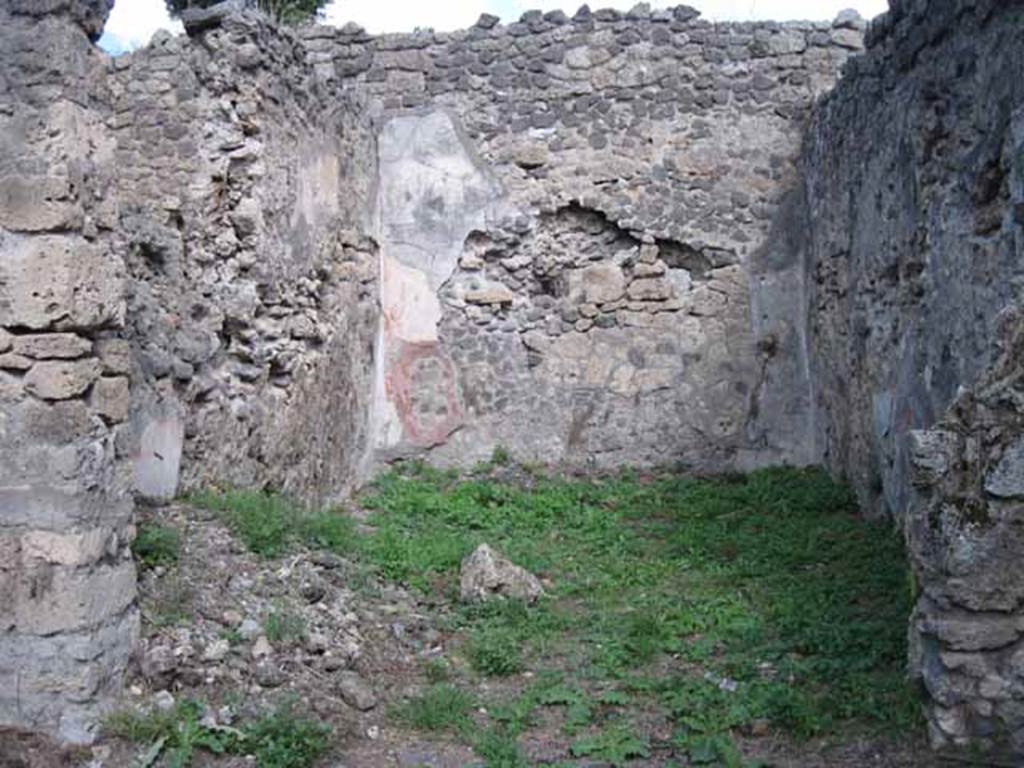 I.2.28 Pompeii. September 2010. Looking east into large triclinium on east side of portico. Photo courtesy of Drew Baker. According to Fiorelli, this room was adorned with paintings, of which two were saved. One of a big country scene with pastoral sacrarium and goats. The other showing Cassandra and Hector predicting the ruin of Troy to Priam, caused by the young boy Paris. Paris is leaning against the King�s knee holding an apple. See Pappalardo, U., 2001. La Descrizione di Pompei per Giuseppe Fiorelli (1875). Napoli: Massa Editore. (p.37 and black and white drawing)
According to Sogliano, paintings found in the triclinium were �
Amore and Psiche at the hunt, on a black background, and Eros at the hunt, on a black background (p. 64, nos. 374 and 375).
Prophecy of Cassandra. Now in Naples Archaeological Museum: 111476.This was found damaged at the upper corner (p.105, no.560).  
Landscape: the scene represented a valley between high mountains (p.141, no.684)
See Sogliano, A., 1879. Le pitture murali campane scoverte negli anni 1867-79. Napoli: (pages, as above)

