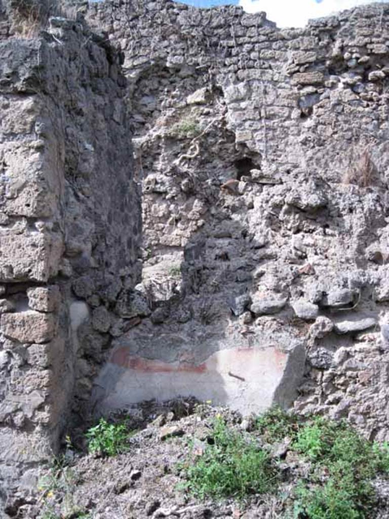 I.2.28 Pompeii. September 2010. Looking north at west end of north wall of large room. Photo courtesy of Drew Baker.

