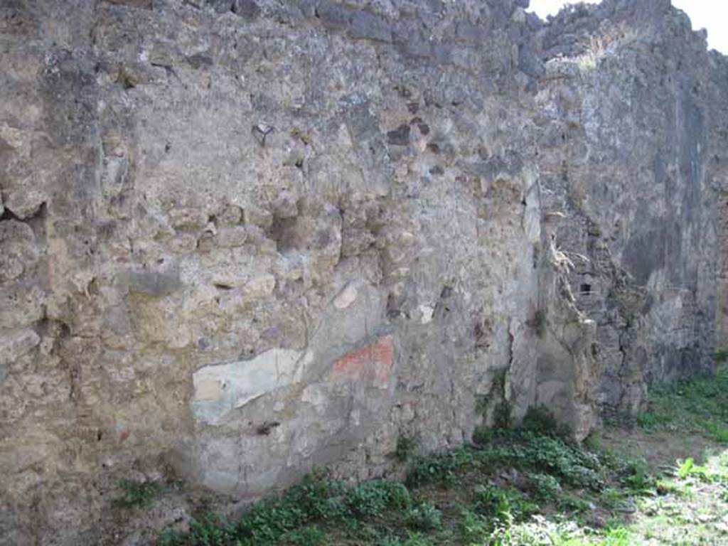 I.2.28 Pompeii. September 2010. South wall and south-west corner of large room. Photo courtesy of Drew Baker.
