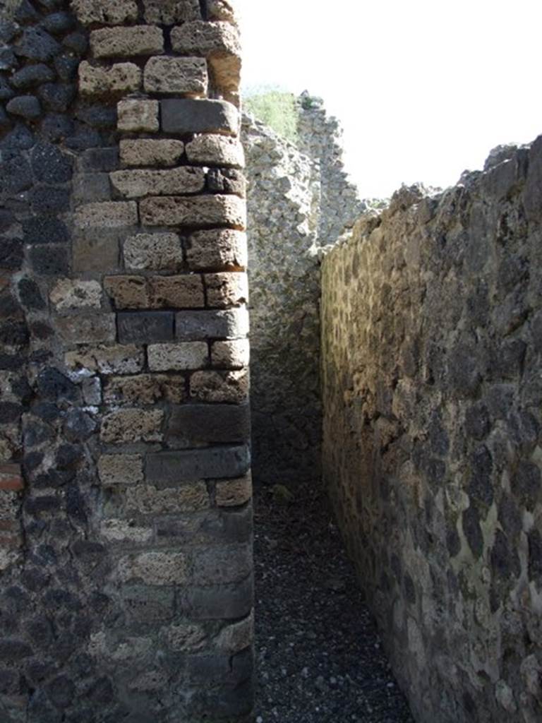 I.3.31 Pompeii. March 2009. Looking south along narrow corridor, or possible latrine.