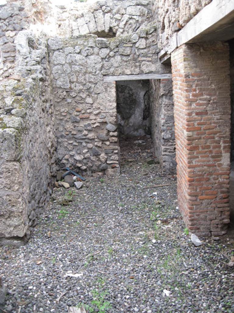 I.3.3 Pompeii. September 2010. Looking east across area of wider corridor, from north end of narrow corridor. On the left can be seen the doorway to the second triclinium, ahead is a doorway to an area that Fiorelli called �il repositorio�. On the right are the two doorways to the kitchen area.  Photo courtesy of Drew Baker
