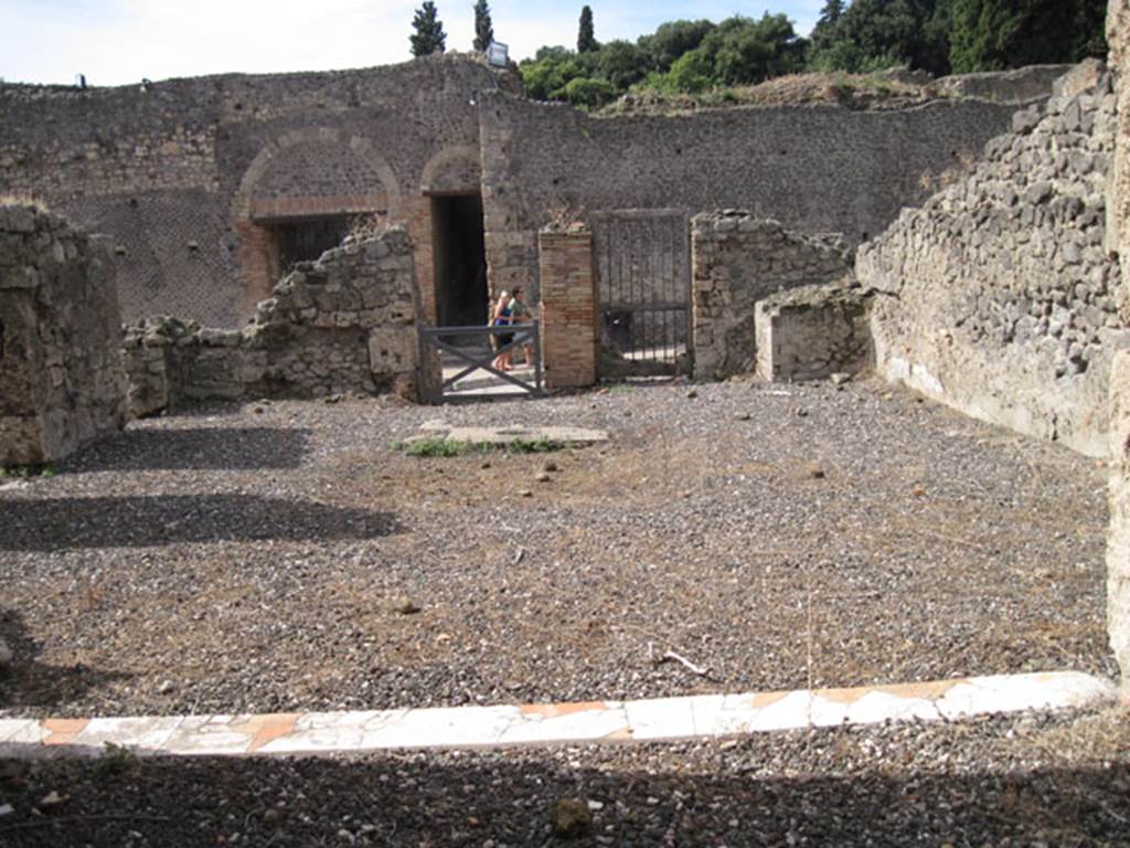 I.3.3 Pompeii. September 2010. Looking west from tablinum, across atrium towards entrance doorway onto Via Stabiana. Photo courtesy of Drew Baker.
