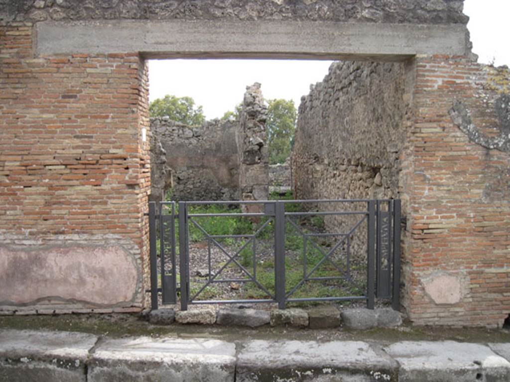 I.3.14 Pompeii. September 2010. Looking south towards entrance doorway.
Photo courtesy of Drew Baker.  
On the pilaster on the left side, Fiorelli was able to read the following inscription written in red.
Even then it had almost totally vanished:
VATIAM   AED(ilem)
VERVS   INNOCE(n)S   FACIT
PAPILIO    [CIL IV 1080]
See Pappalardo, U., 2001. La Descrizione di Pompei per Giuseppe Fiorelli (1875). Napoli: Massa Editore.(p. 39)
Also on the pilaster on the left side, written in red, was:
Q(uintum)  POSTVMIVM  PROCV(lu)M
AED(ilem)  O(ro)  V(os)  F(aciatis)  SEXTILIVS  VERVS  FACIT [CIL IV 1081]
Found 19th July 1853. PAH II. 568.
See Pagano, M. and Prisciandaro, R., 2006. Studio sulle provenienze degli oggetti rinvenuti negli scavi borbonici del regno di Napoli. Naples: Nicola Longobardi. (p.169) 
According to Della Corte, both these inscriptions were written on the left side of the entrance.
See Della Corte, M., 1965.  Case ed Abitanti di Pompei. Napoli: Fausto Fiorentino. (p.266)
