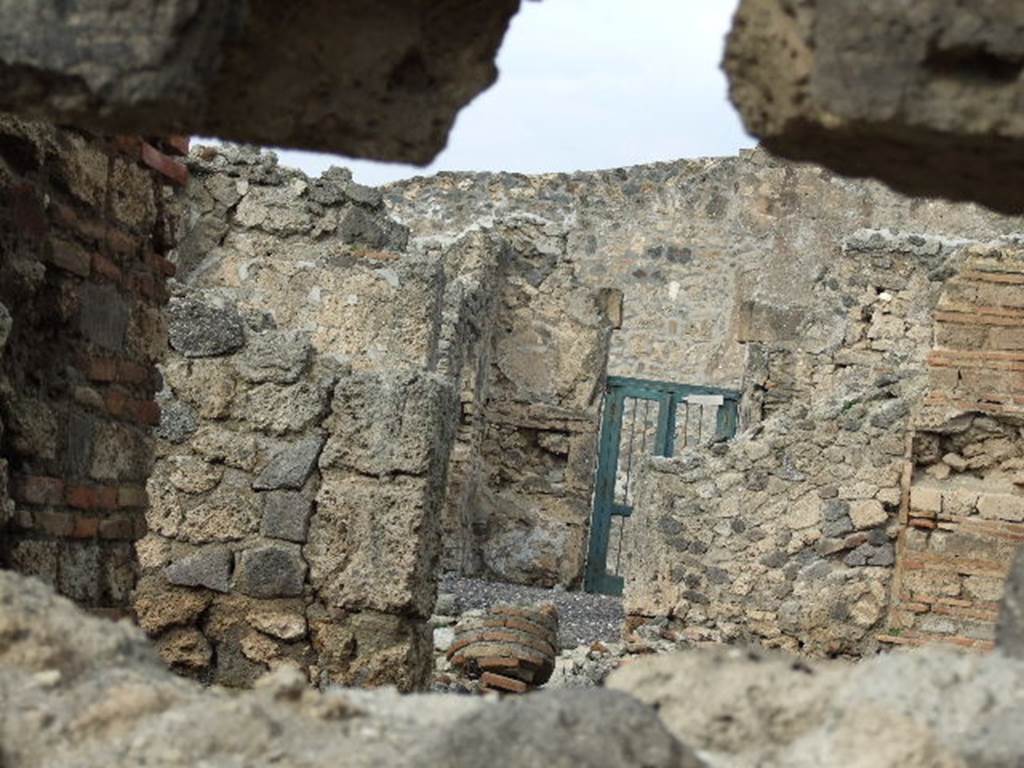I.3.23 Pompeii. December 2006. Looking north from rear to front entrance doorway, taken from I.3.25.