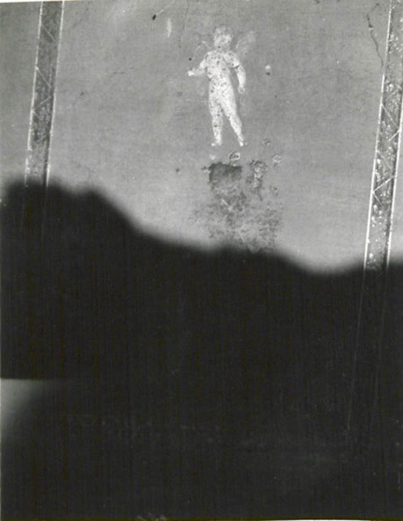 I.3.24 Pompeii. 1935 photograph taken by Tatiana Warscher. According to Warscher: 
“A l’epoca degli scavi la casa era riccamente dipinta, ma di queste pitture avanza nulla tranne una figura di Amore (nel cubicolo sul lato est del peristilio”.)
See Warscher, T, 1935: Codex Topographicus Pompejanus, Regio I, 3: (no.55), Rome, DAIR, whose copyright it remains.  
(translation: “At the time of the excavation, this house was richly painted, but nothing remains of these paintings except a figure of Cupid (in the cubiculum on the east side of the peristyle”).
According to Sogliano, the following paintings were also found in this room –
Leda (found destroyed), p.23, no.85
Mars and Venus (found destroyed), p.34, no.136
Two flying cupids, one with bunch of grapes and crook, the other with his crook, p.56, nos. 286 and 287
Flying cupid with dish full of grass/plants (found destroyed), p.59, no.326
Female figure carrying a basket in her left hand, p.158, no.819
Female figure turned to the left, with a garland in her right hand, and a basket of flowers in her left, p.159, no.829
See Sogliano, A., 1879. Le pitture murali campane scoverte negli anni 1867-79. Napoli: Giannini. 
According to Fiorelli, found in this room were paintings of  – Mars, Venus and Cupid, Leda and the Swan, four Cupids, two flying female figures hovering in the air carrying baskets.
See Pappalardo, U., 2001. La Descrizione di Pompei per Giuseppe Fiorelli (1875). Napoli: Massa Editore, (p.40)
