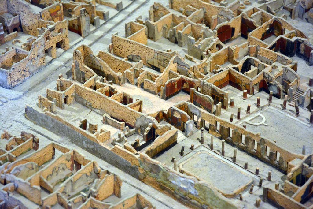 I.4.2 Pompeii, centre left. October 2019. Looking north-west.
On left is Via Stabiana, at junction with Vicolo del Menandro, I.4.2 is on the left, on the north side of the roadway. 
Foto Tobias Busen, ERC Grant 681269 D�COR.
