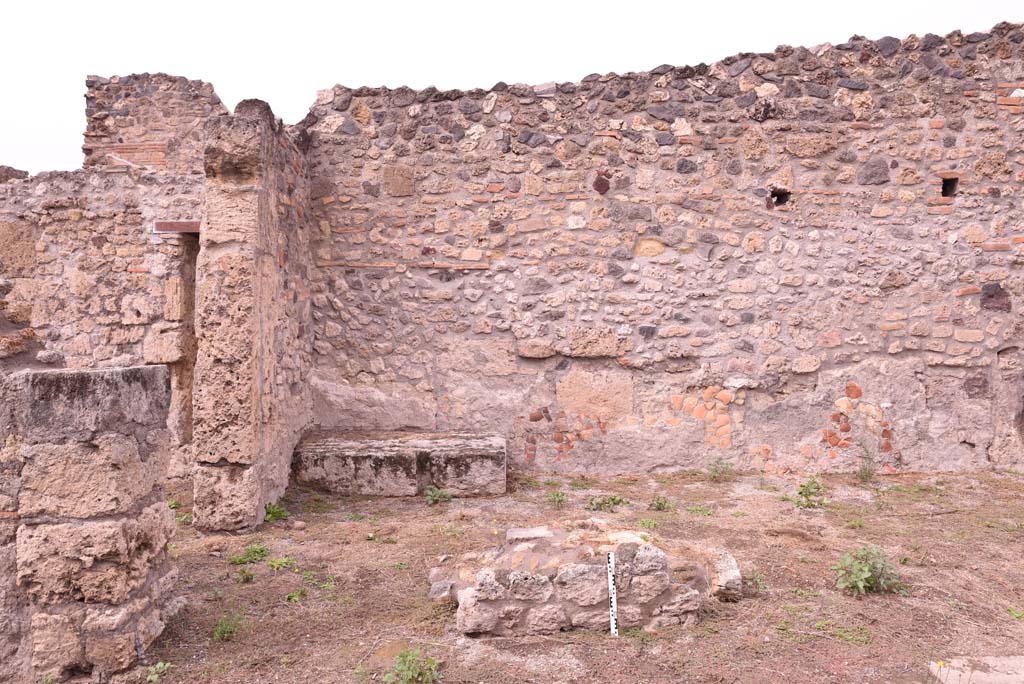 I.4.2 Pompeii. October 2019. 
Looking north across west end of atrium, towards bench/podium and hearth in north-west corner, with doorway to the bar at I.4.3, on left.
Foto Tobias Busen, ERC Grant 681269 D�COR.
