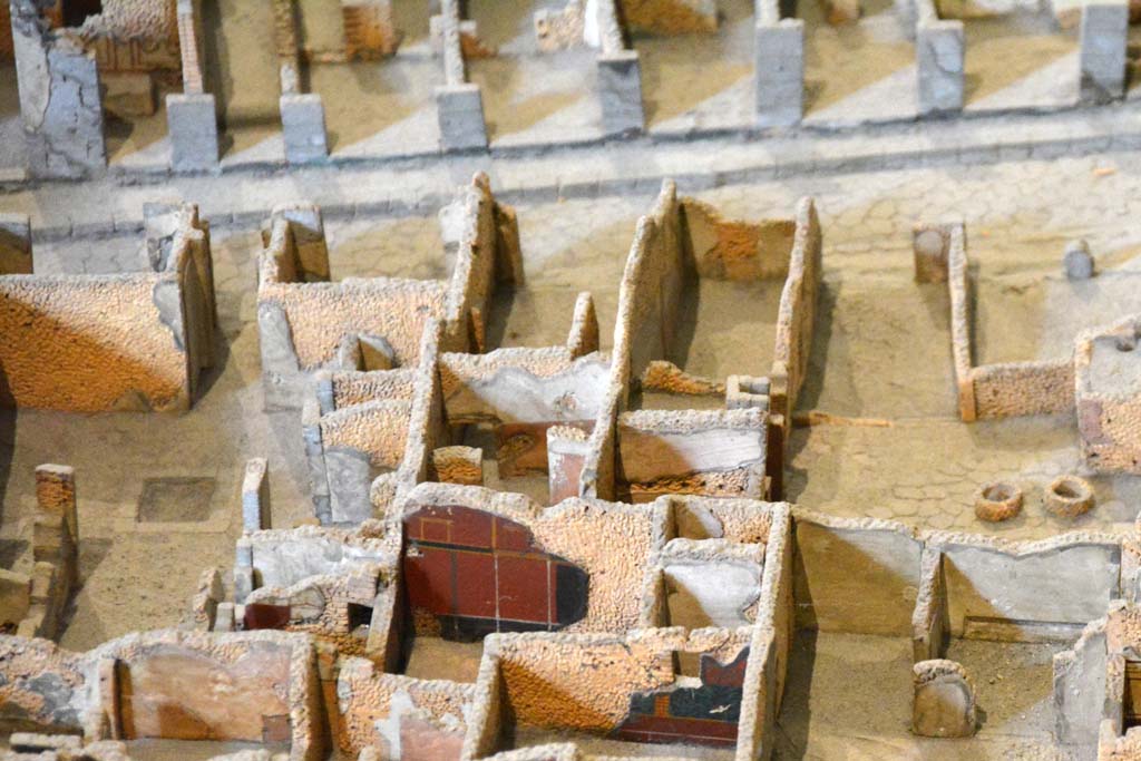 I.4.9 Pompeii. May 2019. Detail from model in Naples Archaeological Museum.
Triclinium/oecus m, according to the model, the west wall of the triclinium, painted black/red, is shown in the lower centre.
Foto Tobias Busen, ERC Grant 681269 D�COR.

