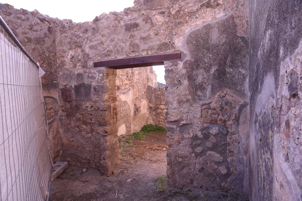 I.4.19 Pompeii. October 2019. 
Looking towards south wall with doorway to rear room, on the left would have been the base of the stairs for an upper floor.
Foto Tobias Busen, ERC Grant 681269 D�COR.
