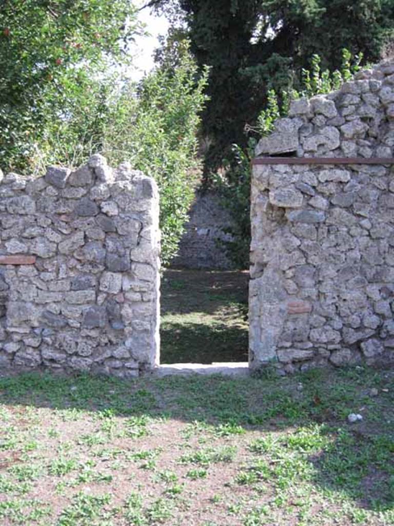 I.5.2 Pompeii. September 2010. Doorway in south wall of peristyle area, leading to large open area. Photo courtesy of Drew Baker.