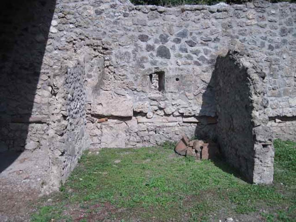 I.5.2 Pompeii. September 2010. Looking east towards left-hand bay, one of six divided compartments. Note the pipe work in wall. Photo courtesy of Drew Baker.