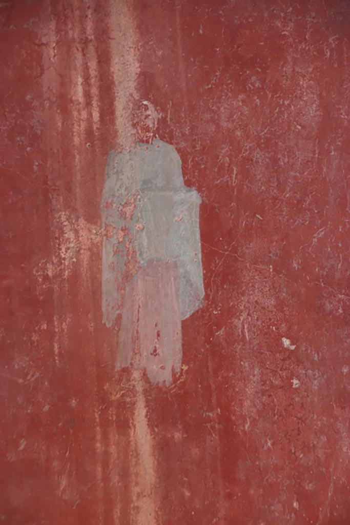 I.6.4 Pompeii. October 2022.
Room 5, detail of painted figure from west end of north wall. Photo courtesy of Klaus Heese.