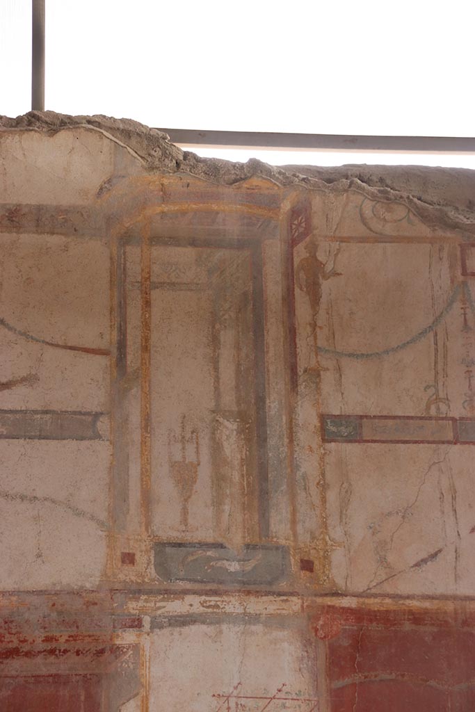 I.6.4 Pompeii. October 2024.
Room 5, detail from upper east wall towards south end. Photo courtesy of Klaus Heese.