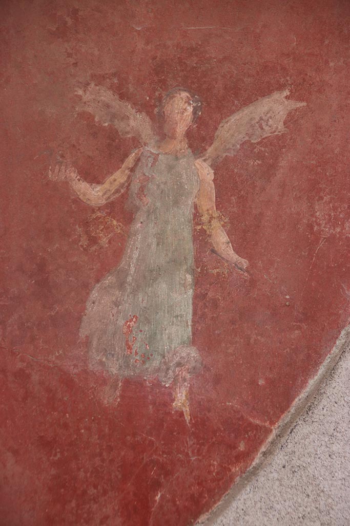 I.6.4 Pompeii. October 2024.
Room 5, detail of flying figure from north end of east wall. Photo courtesy of Klaus Heese.