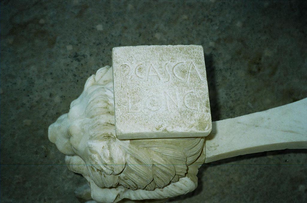 I.6.11 Pompeii. June 2010. On top of the first table leg is P(VBLIVS) CASCA LONG(INVS).
See Della Corte, M., 1965. Case ed Abitanti di Pompei. Napoli: Fausto Fiorentino. (p. 285). Photo courtesy of Rick Bauer.
