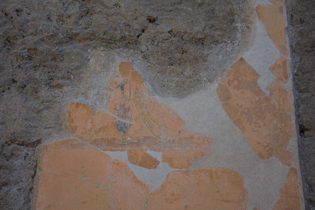 I.7.1 Pompeii. October 2019. Detail of painted vignette of shield and vase on yellow panel, south of centre of east wall of atrium. 
Foto Annette Haug, ERC Grant 681269 D�COR.




