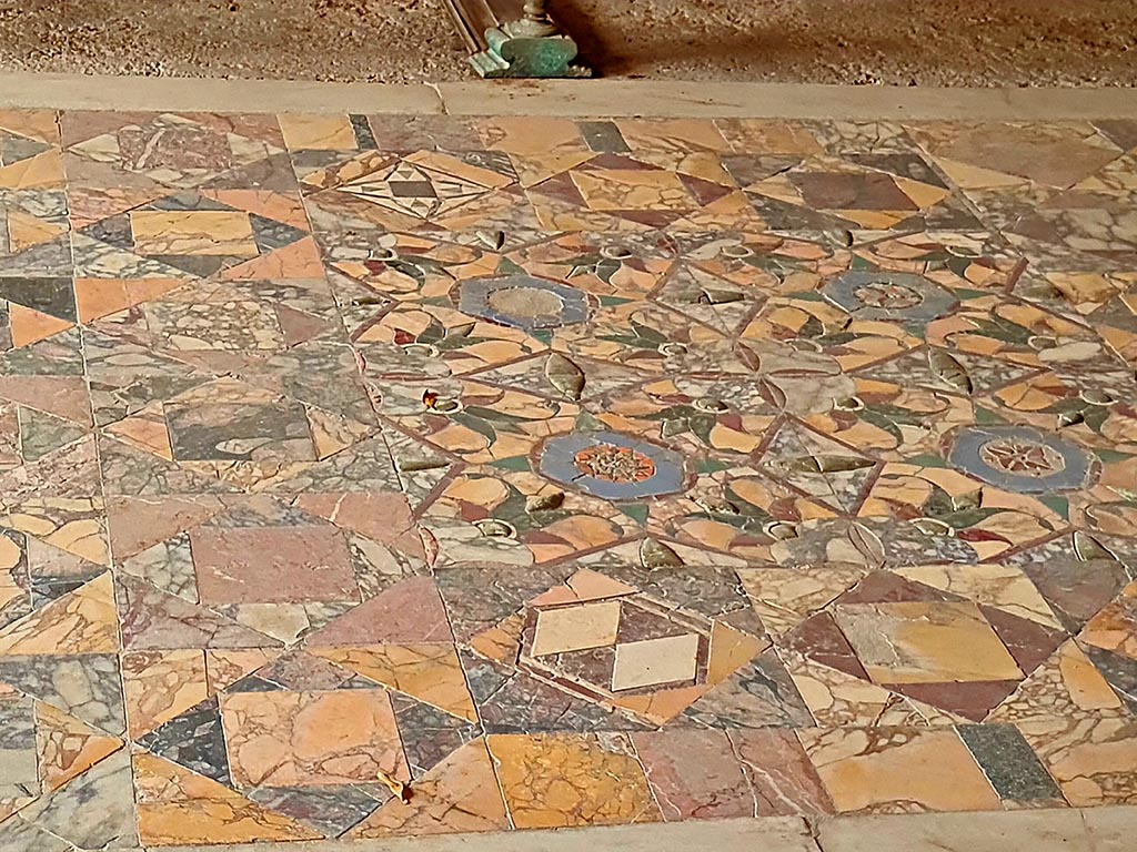 I.7.11 Pompeii. September 2024. Central emblema set in triclinium floor. Photo courtesy of Giuseppe Ciaramella.