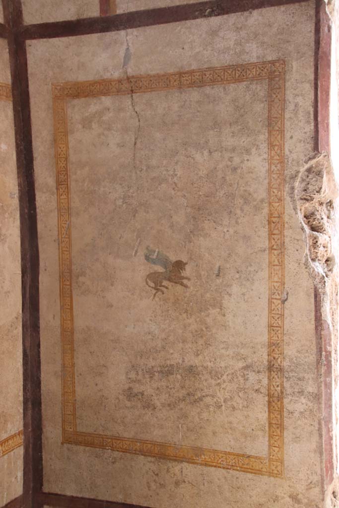 I.7.11 Pompeii. September 2021. West wall with painted panel. Photo courtesy of Klaus Heese.
