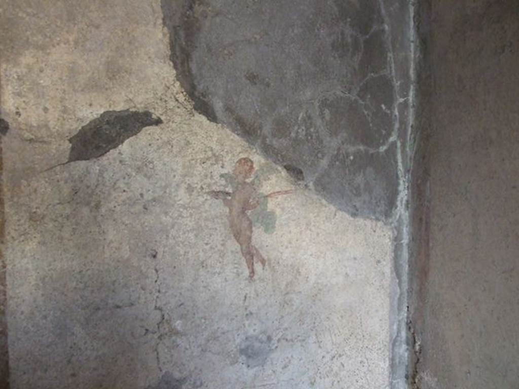 .7.11 Pompeii. December 2006.  Wall painting of flying cupid from north end of west wall of bedroom on west side of atrium.
