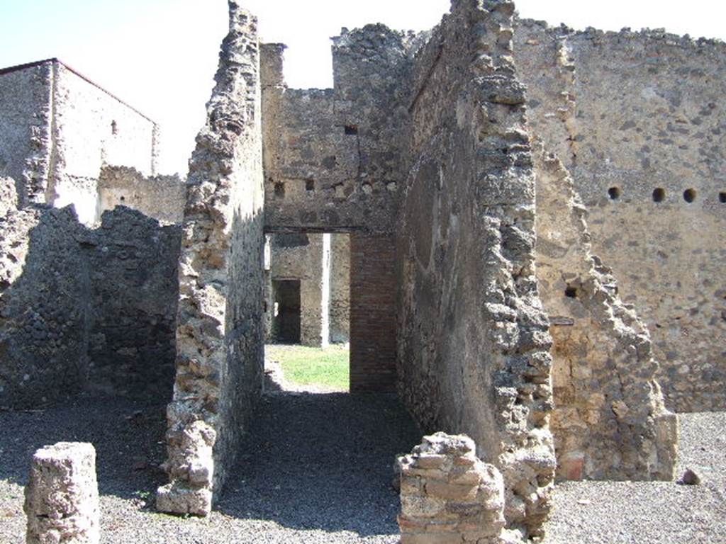 I.7.16 Pompeii. September 2005. Entrance doorway, leading into courtyard. Looking east. In the south-east corner of the courtyard was a summer triclinium. According to Della Corte, graffiti found on the walls of the courtyard gave the names of the �scriptores� �  Astylus, Iarinus, Papilio and Tychicus  [CIL IV 7243, 7248, 7249 and 7251]
According to Epigraphik-Datenbank Clauss/Slaby (See www.manfredclauss.de), these read as -
L(ucio)  Ael(i)o  Magno 
feliciter  Astylus 
Iarine fellas         [CIL IV 7243]
Papilio  v(ir)  b(onus)       [CIL IV 7248a]
Astylus                [CIL IV 7248b]
Tychice  habeas  magnum  propitium       [CIL IV 7249]
L(ucium)  Ceium  Secundum  IIvir(um)  o(ro)  v(os)  f(aciatis)  d(ignum)  r(ei)  p(ublicae) 
Papilio                 [CIL IV 7251]

