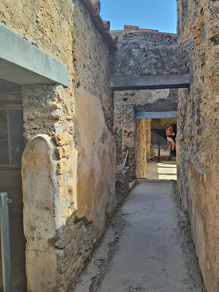 I.7.19 Pompeii. September 2024. 
Looking east along corridor towards pseudoperistyle. Photo courtesy of Giuseppe Ciaramella.
