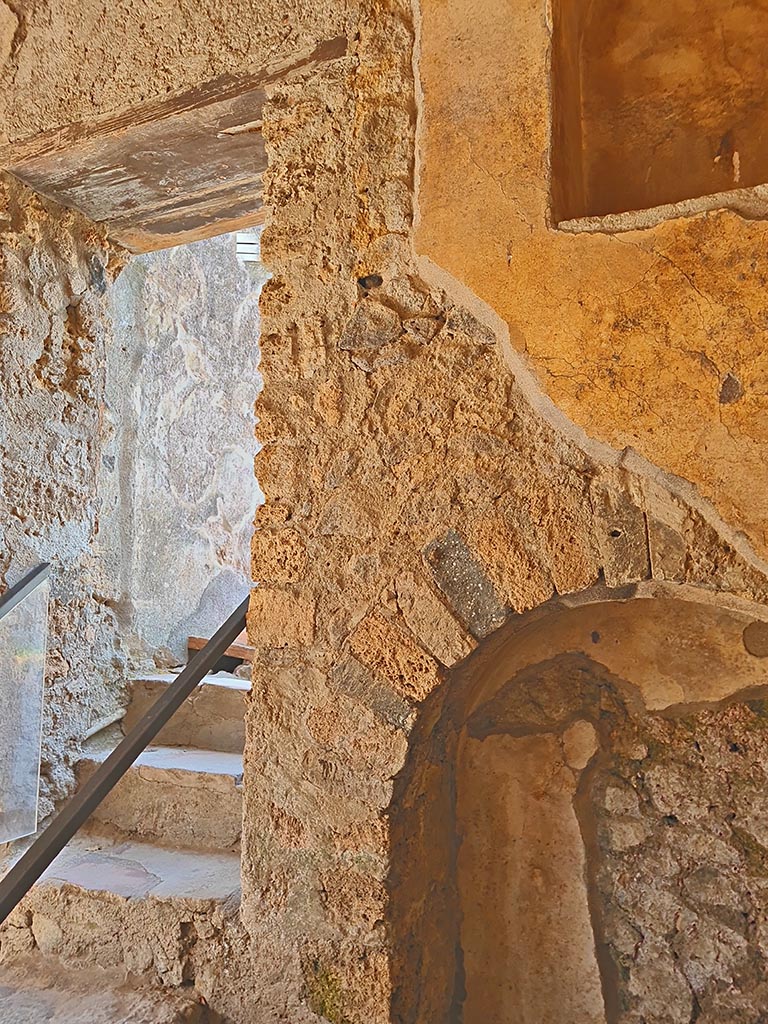 I.7.19 Pompeii. September 2024. 
Looking north to steps to garden area, and parts of two niches. Photo courtesy of Giuseppe Ciaramella.

