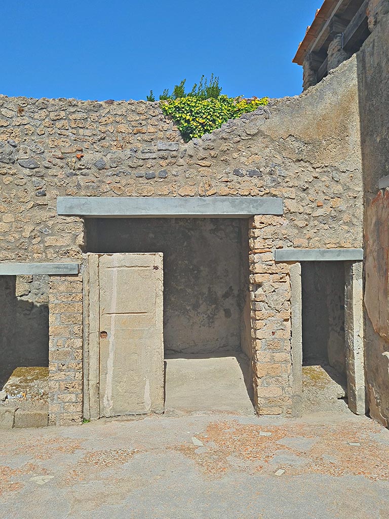 I.7.19 Pompeii. September 2024. 
Doorways to rooms on north side of atrium. Photo courtesy of Giuseppe Ciaramella.
