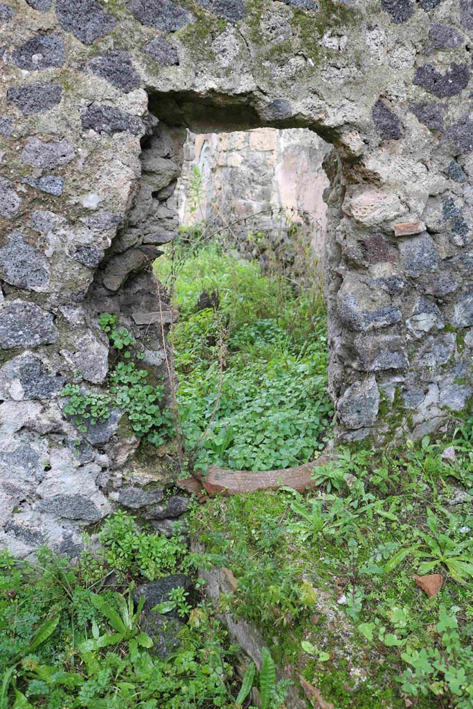 I.8.16 Pompeii. December 2018. 
Looking east through hole-in-the wall into I.8.14. Photo courtesy of Aude Durand.
