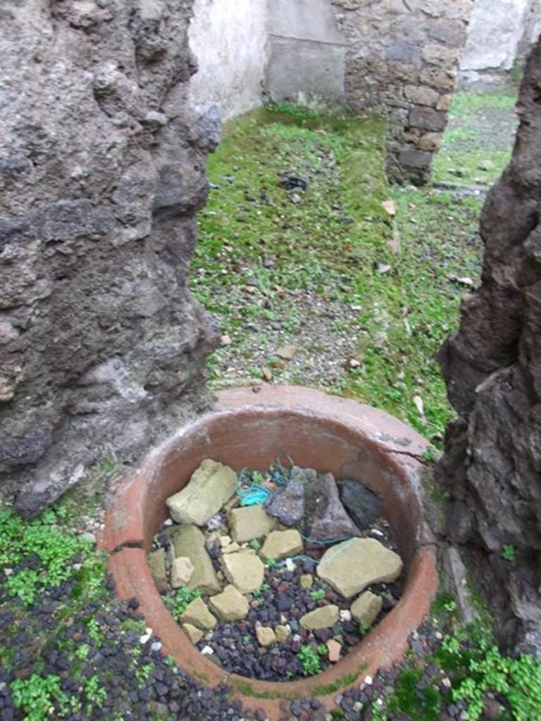 I.8.16 Pompeii, looking through a hole in the wall from I.8.14. Looking west into the open area described as a kitchen.
See Castiglione, V., Del Franco, M., and Vitale, R: �L�insula 8 della Regio I, un campione d�indagine socio-economica�, Rivista di Studi Pompeiani, Vol III, 1989, (p.185-221).
