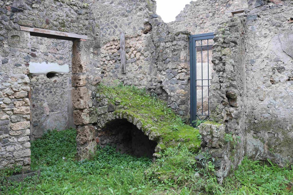 I.8.16 Pompeii. December 2018. Looking south-west across room/garden towards doorway to rear room of I.8.15, on left.
On the right is the entrance doorway on Vicolo dell�Efebo, which gave access to the stairs to the upper floor.
Photo courtesy of Aude Durand.
