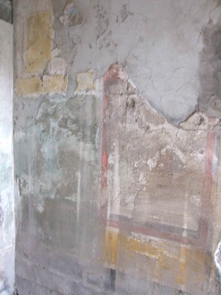 I.8.17 Pompeii. December 2007. Room 16. North wall to the west of the door. Remains of a wall painting of Ariadne, Athena and Theseus?
See Bragantini, de Vos, Badoni, 1981. Pitture e Pavimenti di Pompei, Parte 1. Rome: ICCD. (p.87). According to Peters, from the right upper corner a large portion of the stucco is missing. Ariadne was sleeping, on the right. Theseus was standing near her, but looking left towards Athena. The yellow of Ariadne’s pillow and the carmine, yellow and green of the clothes form a vivid contrast to the sober surroundings.
See Peters, W.J.T. (1963): Landscape in Romano-Campanian Mural Paintings.The Netherland, Van Gorcum & Comp. (p.99-100)