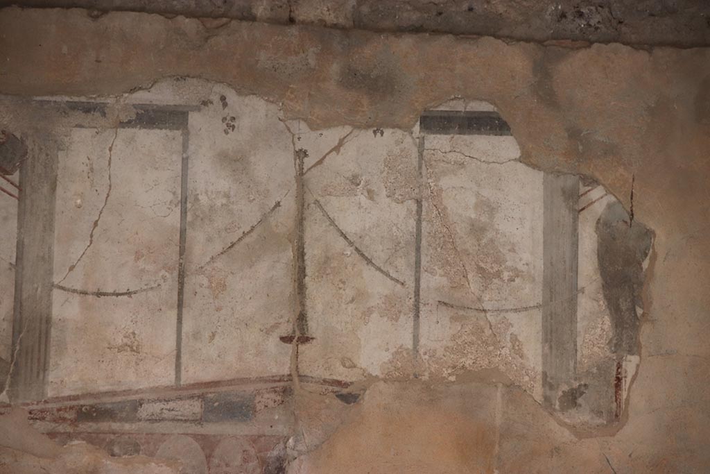 I.8.17 Pompeii. October 2024. Room 18, detail from upper centre of west wall. Photo courtesy of Klaus Heese.