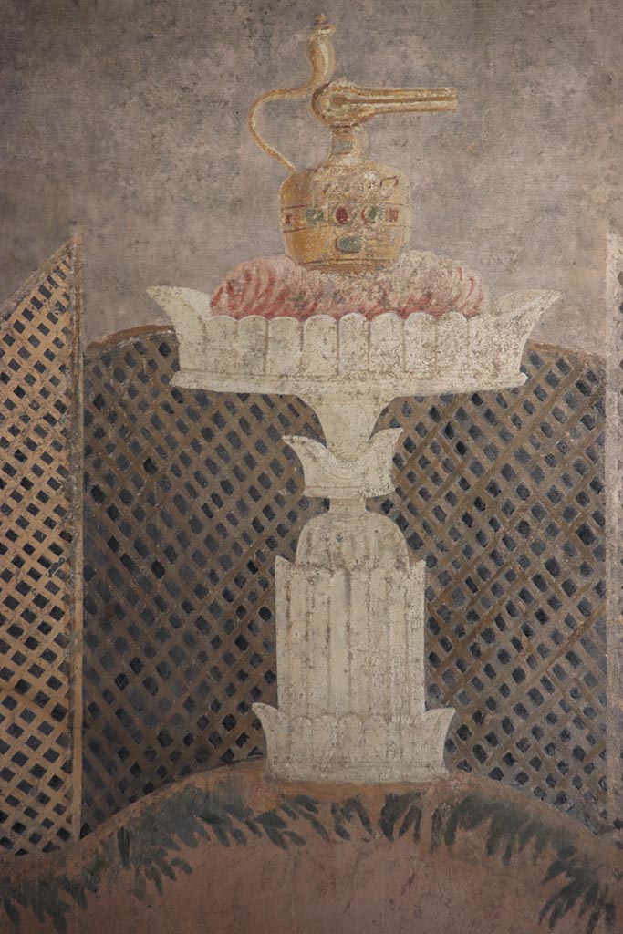 I.9.5 Pompeii. October 2024.
Room 11, looking towards centre of east wall with painted table with Isis jug or jar. 
Photo courtesy of Klaus Heese
