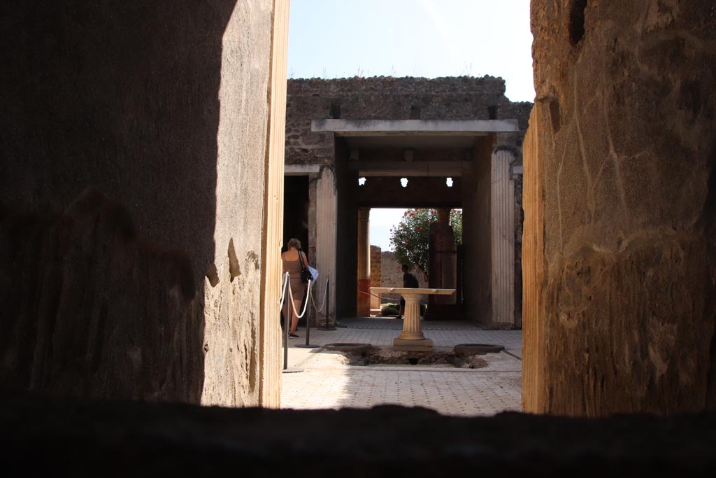 I.9.5 Pompeii. October 2023. Room 1, fauces. Looking south across atrium from entrance corridor. Photo courtesy of Klaus Heese.