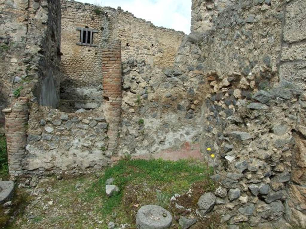I.9.12 Pompeii. March 2009.  Room 9.  Looking north, showing bricked up peristyle columns, and towards rear yard, of 1.9.11