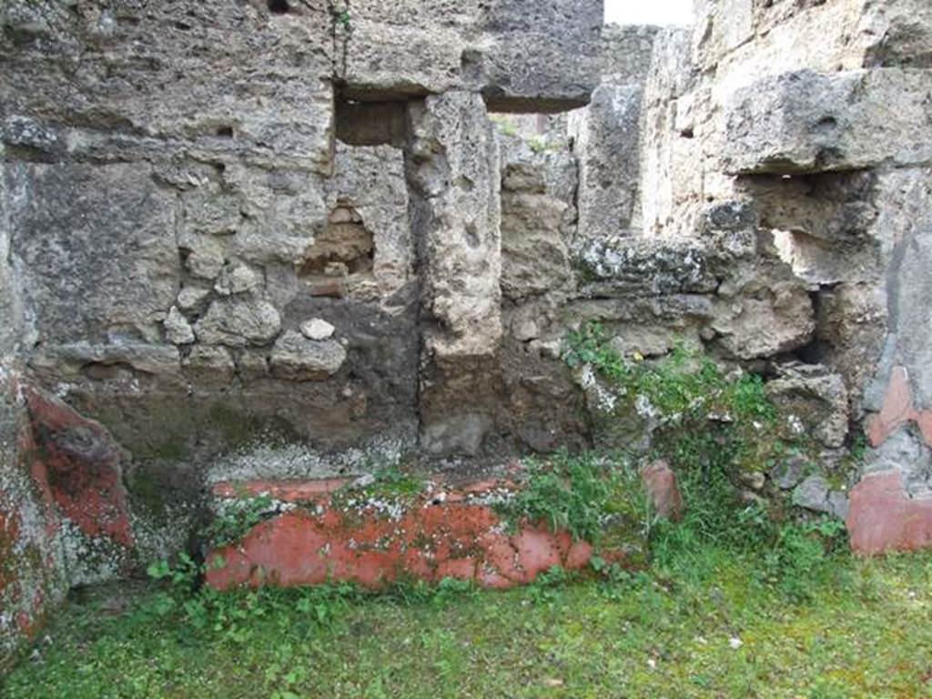 I.9.12 Pompeii.  March 2009.  Room 9.  West wall, with remains of painted plaster.