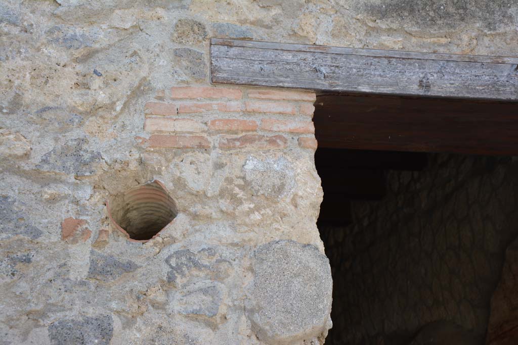 I.10.1 Pompeii. April 2017. Detail from east side of entrance doorway. Photo courtesy Adrian Hielscher.