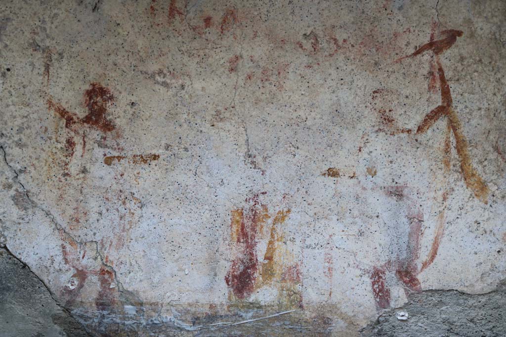 I.10.3 Pompeii. December 2018. Detail of remaining figures on niche on east wall of fauces. Photo courtesy of Aude Durand.